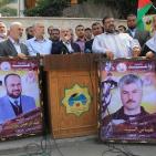 رسم حي لجدارية تضامنية لخضر عدنان في اعتصام ذوي أسرى غزة