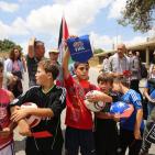 النبي صالح: نشطاء يرفعون البطاقات الحمراء دعما  لوقف عضوية الاحتلال في الفيفا