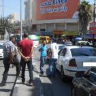 بالصور: المركبات الخاصة تعمل أمام شرطة المرور دون مساءلة في الخليل