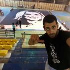 فنان فلسطيني يحقق رقما قياسيا برسم اكبر لوحة وجه في العالم