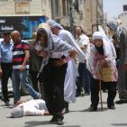 إعادة تمثيل مشهد من النكبة عام 1948 خلال مسيرة بمناسبة ذكرى النكبة في مدينة رام الله