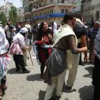 إعادة تمثيل مشهد من النكبة عام 1948 خلال مسيرة بمناسبة ذكرى النكبة في مدينة رام الله