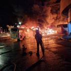 بالفيديو: حريق ضخم يلتهم 18 حافلة بالمحطة المركزية في صفد