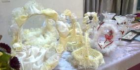 بالصور: إقامة معرض "تسلم الأيادي" في الخليل