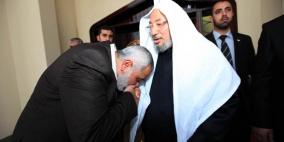 هنية يمنح القرضاوي الجنسية الفلسطينية