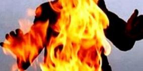 مواطن يشعل النار في زوجته