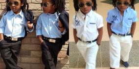 بالصور.. توأم بريطاني صغير يعشق الموضة