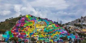 بالصور ـ فنانون مكسيكيون يحوّلون حياً شعبياً إلى لوحة ملوّنة!