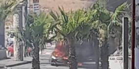 احتراق مركبة في "الرام" بقنابل الاحتلال
