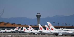 إصابات بكورونا تربك مئات الرحلات الجوية في الصين