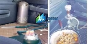 الأردن: ضبط سائق يطهو الطعام ويدخن الأرجيلة داخل مركبته