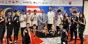 فلسطين تحصد 13 ميدالية ببطولتيّ العالم والأندية للعبة "المواي تاي" في ماليزيا