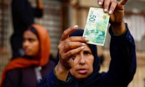 خاص | الكاش يتحول إلى عبء.. سوق سوداء تتحكم في حركة النقد بغزة