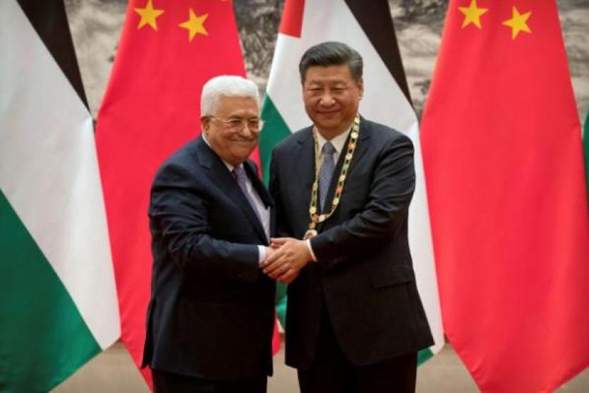  الرئيس عباس ونظيره الصيني 