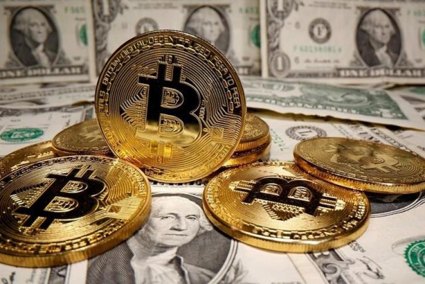 توقعات بأن يصل سعر عملة "البيتكوين" إلى 100 ألف دولار