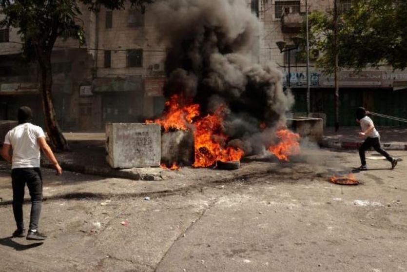 جانب من المواجهات في الخليل (Getty Images)