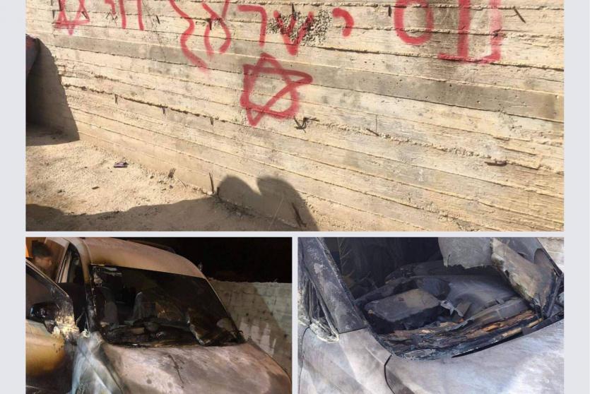 مستوطنون يحرقون مركبتين ويخطون شعارات عنصرية شمال رام الله
