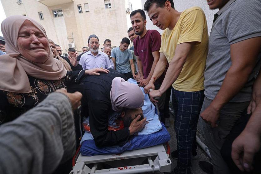 خلال وداع شهداء مجزرة تل اليوم